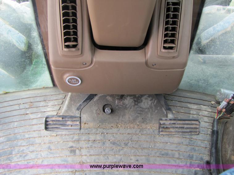 image for item 3144 2004 John Deere 9620 4WD tractor with Grouser 18' two-way blade