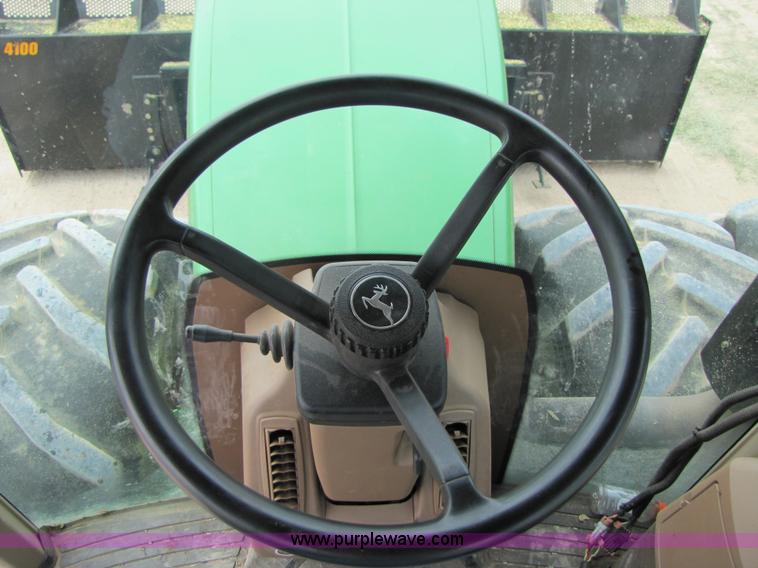 image for item 3144 2004 John Deere 9620 4WD tractor with Grouser 18' two-way blade