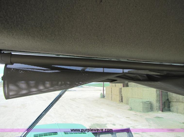 image for item 3144 2004 John Deere 9620 4WD tractor with Grouser 18' two-way blade