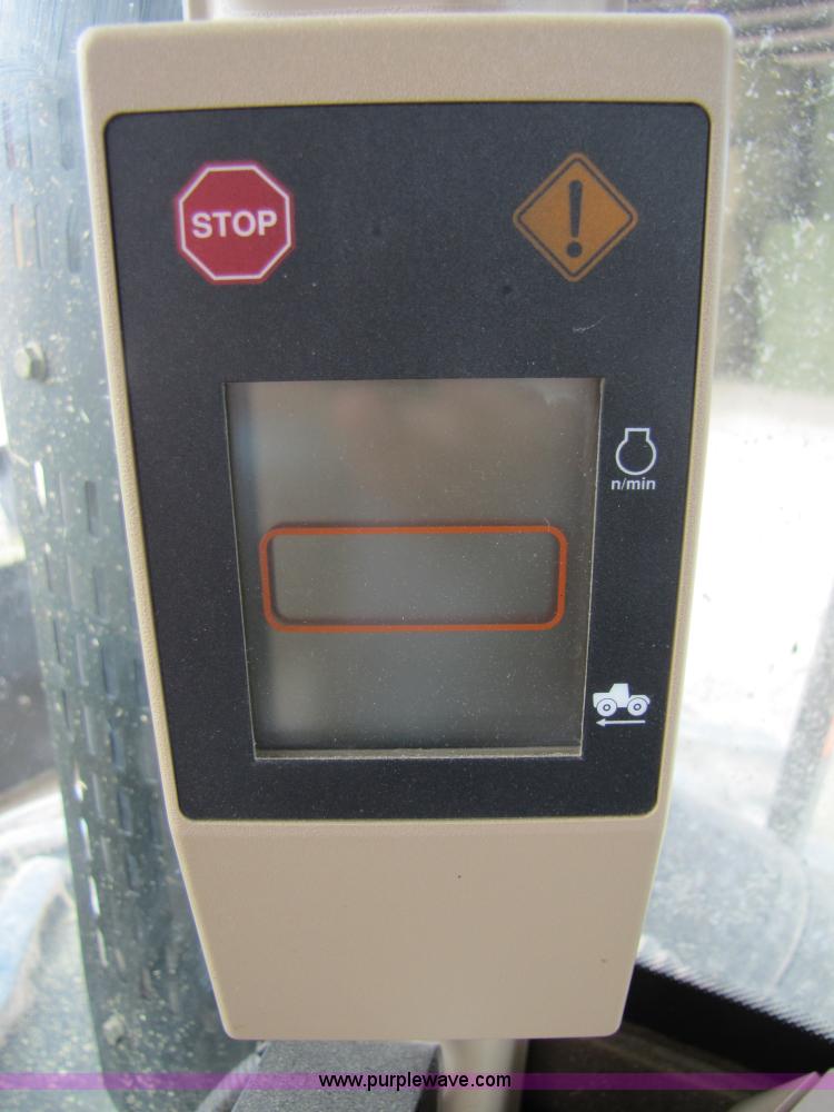 image for item 3144 2004 John Deere 9620 4WD tractor with Grouser 18' two-way blade