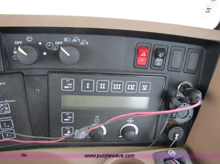 image for item 3144 2004 John Deere 9620 4WD tractor with Grouser 18' two-way blade