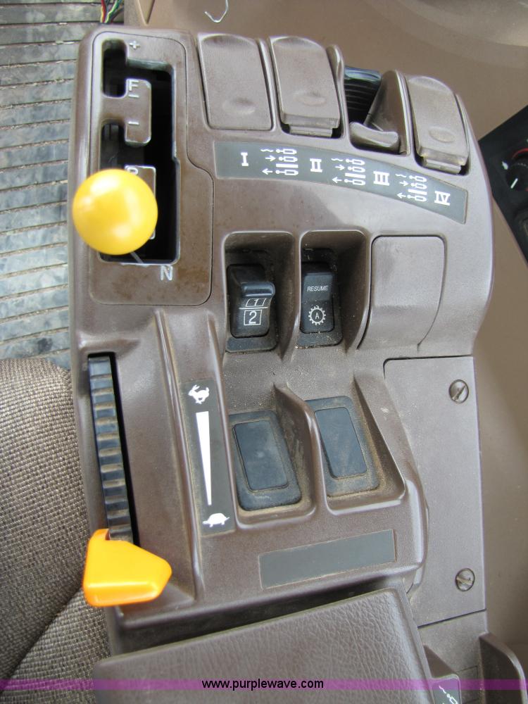 image for item 3144 2004 John Deere 9620 4WD tractor with Grouser 18' two-way blade