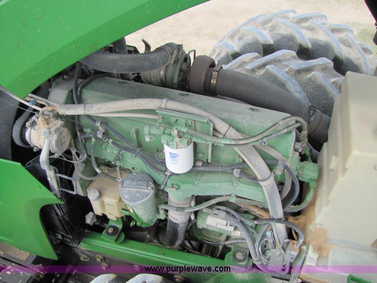 image for item 3144 2004 John Deere 9620 4WD tractor with Grouser 18' two-way blade