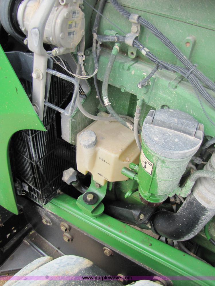 image for item 3144 2004 John Deere 9620 4WD tractor with Grouser 18' two-way blade