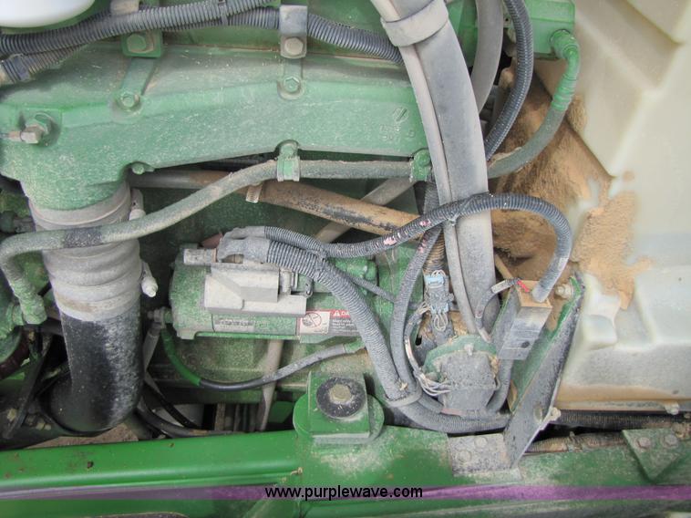 image for item 3144 2004 John Deere 9620 4WD tractor with Grouser 18' two-way blade