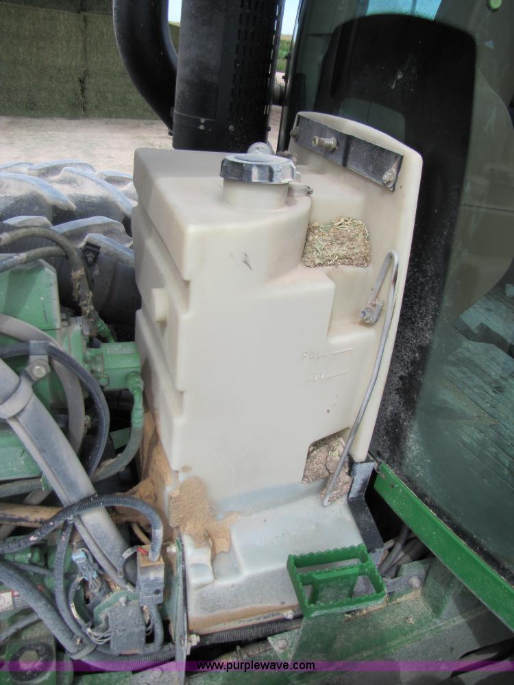 image for item 3144 2004 John Deere 9620 4WD tractor with Grouser 18' two-way blade