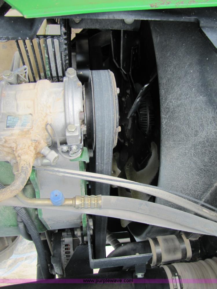 image for item 3144 2004 John Deere 9620 4WD tractor with Grouser 18' two-way blade