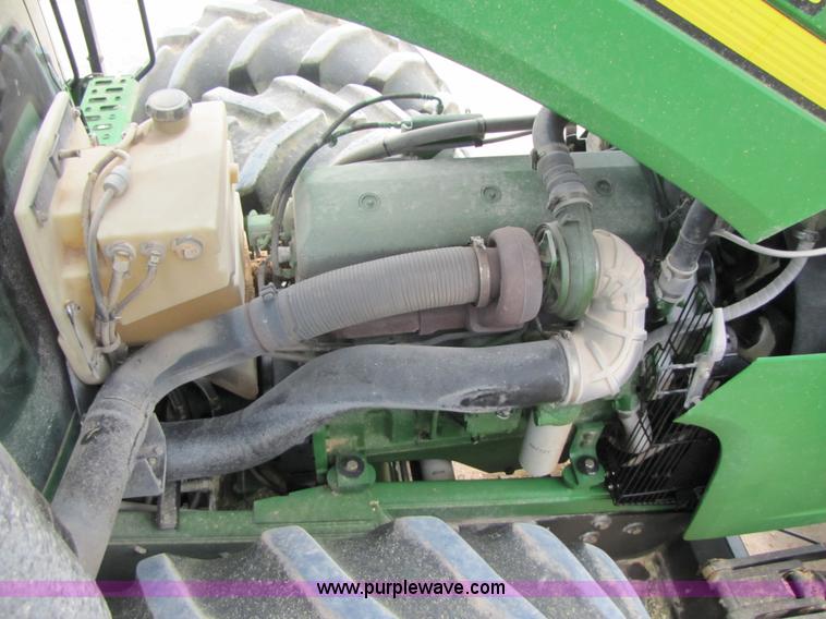 image for item 3144 2004 John Deere 9620 4WD tractor with Grouser 18' two-way blade