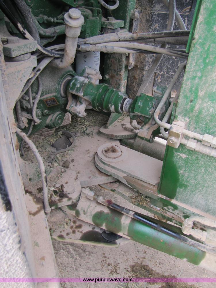 image for item 3144 2004 John Deere 9620 4WD tractor with Grouser 18' two-way blade