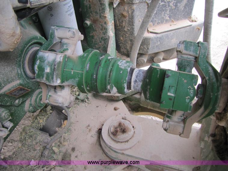 image for item 3144 2004 John Deere 9620 4WD tractor with Grouser 18' two-way blade