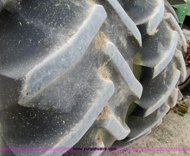 image for item 3144 2004 John Deere 9620 4WD tractor with Grouser 18' two-way blade