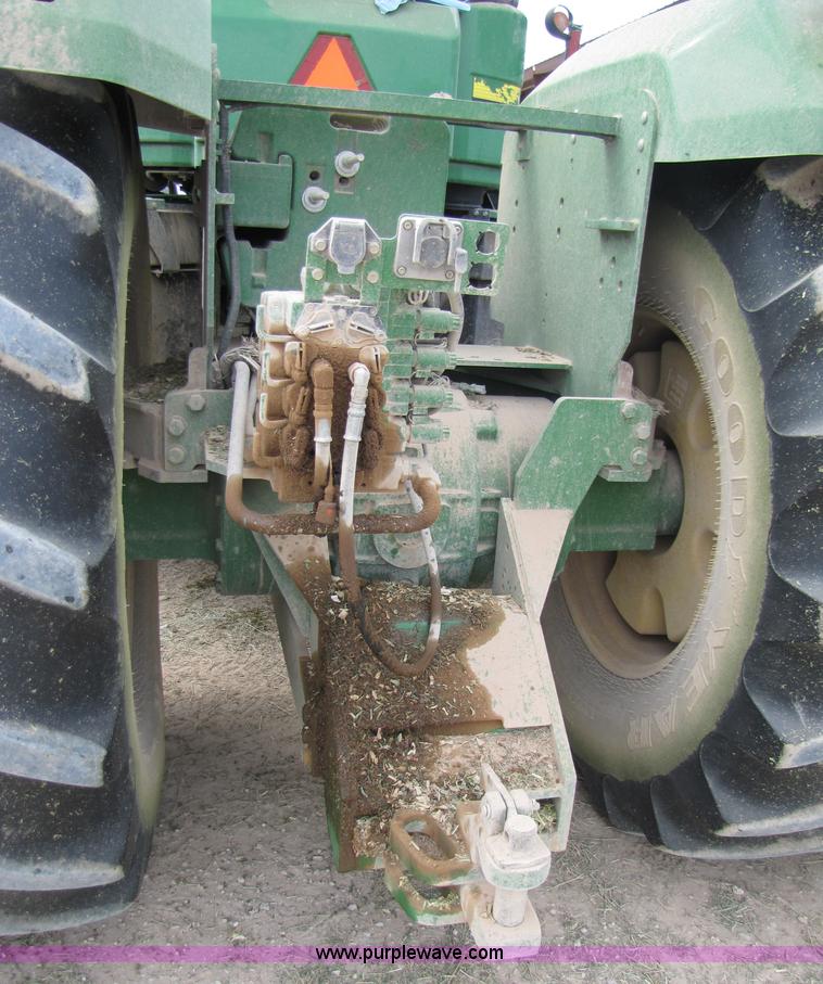 image for item 3144 2004 John Deere 9620 4WD tractor with Grouser 18' two-way blade