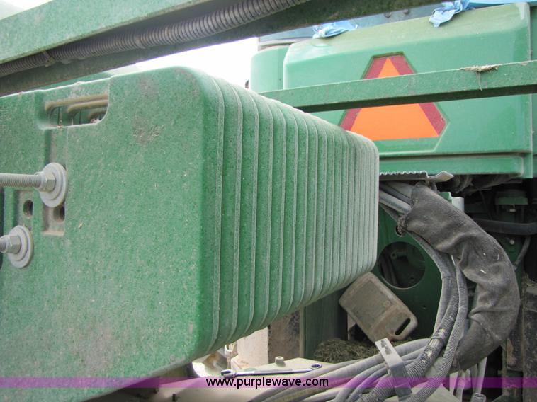image for item 3144 2004 John Deere 9620 4WD tractor with Grouser 18' two-way blade