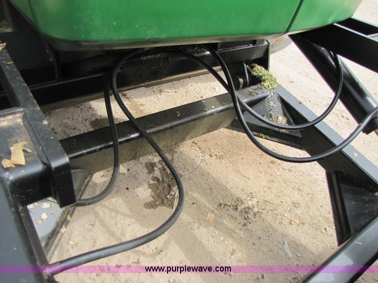 image for item 3144 2004 John Deere 9620 4WD tractor with Grouser 18' two-way blade