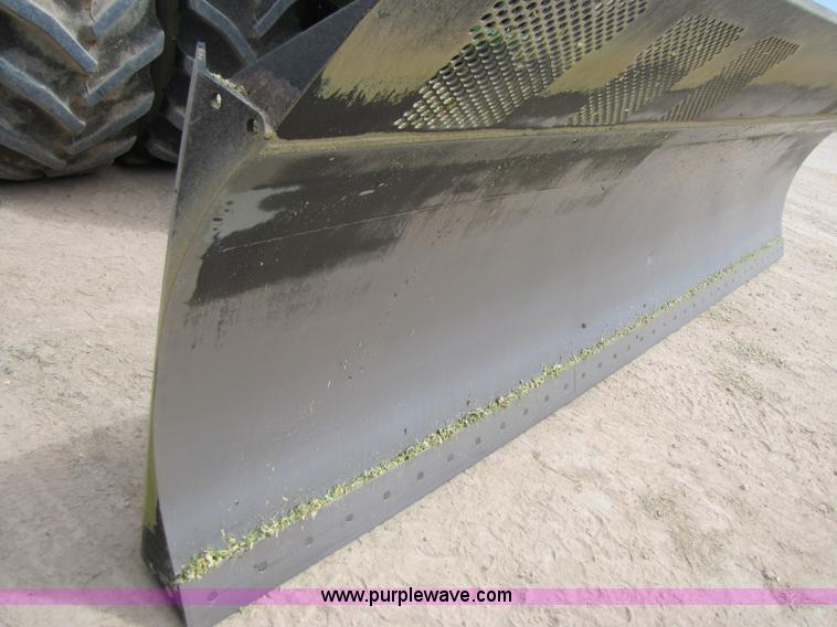 image for item 3144 2004 John Deere 9620 4WD tractor with Grouser 18' two-way blade