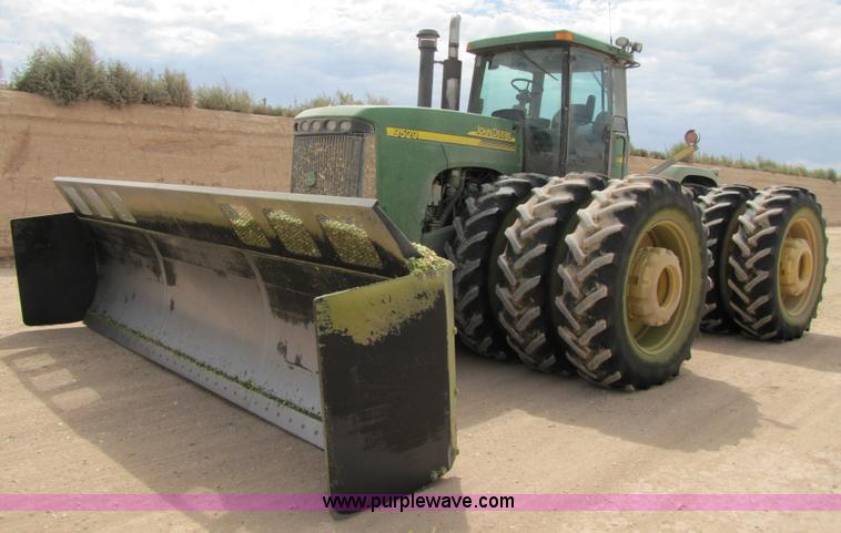 image for item 3145 2005 John Deere 9520 4WD tractor with Grouser two-way blade