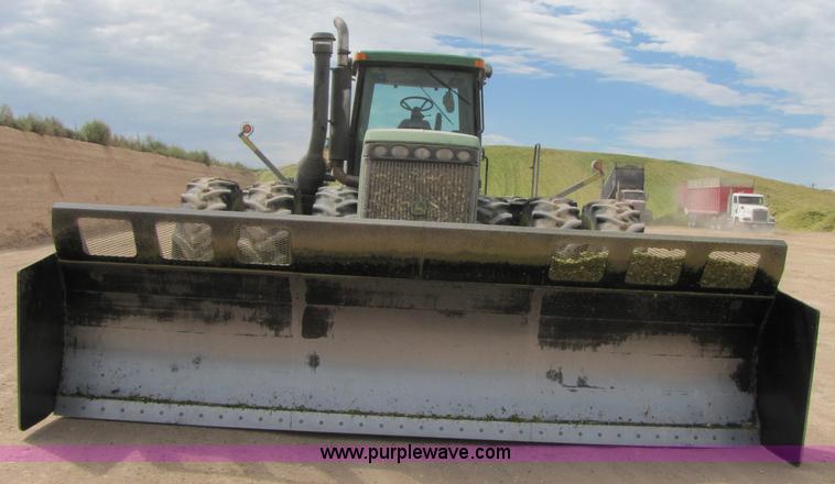 image for item 3145 2005 John Deere 9520 4WD tractor with Grouser two-way blade