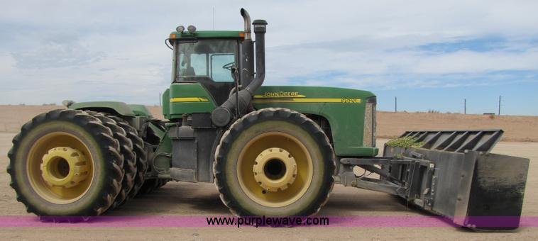 image for item 3145 2005 John Deere 9520 4WD tractor with Grouser two-way blade