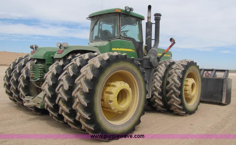 image for item 3145 2005 John Deere 9520 4WD tractor with Grouser two-way blade