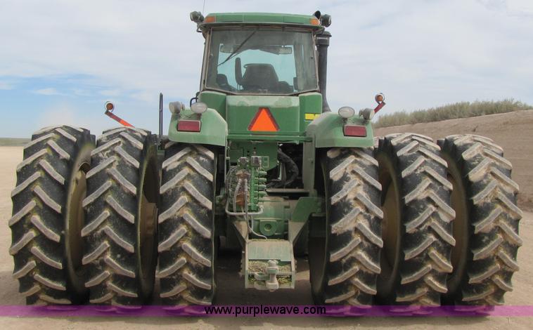 image for item 3145 2005 John Deere 9520 4WD tractor with Grouser two-way blade