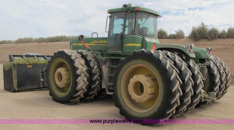 image for item 3145 2005 John Deere 9520 4WD tractor with Grouser two-way blade