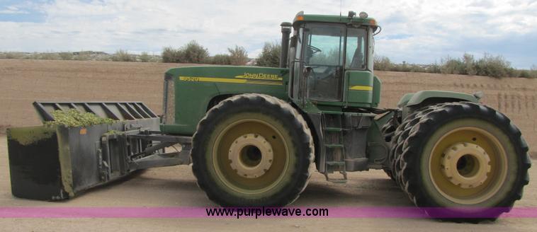 image for item 3145 2005 John Deere 9520 4WD tractor with Grouser two-way blade