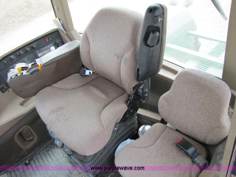 image for item 3145 2005 John Deere 9520 4WD tractor with Grouser two-way blade