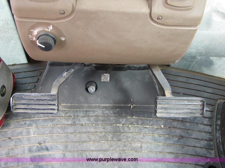 image for item 3145 2005 John Deere 9520 4WD tractor with Grouser two-way blade