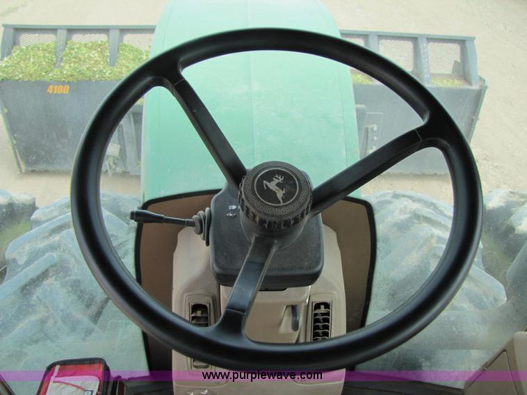 image for item 3145 2005 John Deere 9520 4WD tractor with Grouser two-way blade