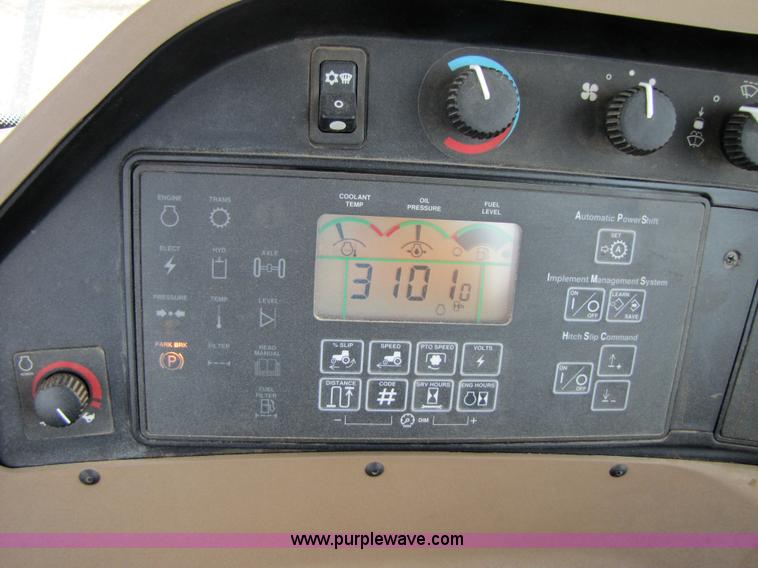 image for item 3145 2005 John Deere 9520 4WD tractor with Grouser two-way blade