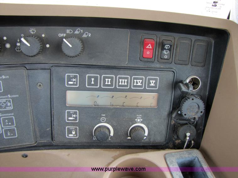 image for item 3145 2005 John Deere 9520 4WD tractor with Grouser two-way blade