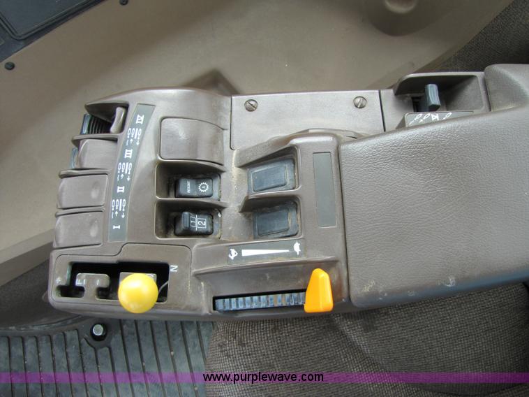 image for item 3145 2005 John Deere 9520 4WD tractor with Grouser two-way blade