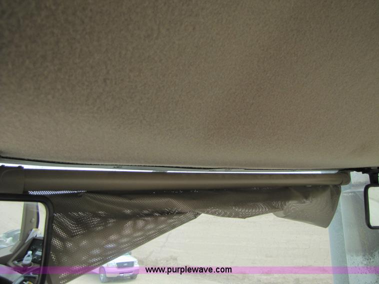 image for item 3145 2005 John Deere 9520 4WD tractor with Grouser two-way blade