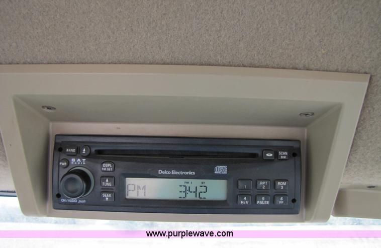 image for item 3145 2005 John Deere 9520 4WD tractor with Grouser two-way blade