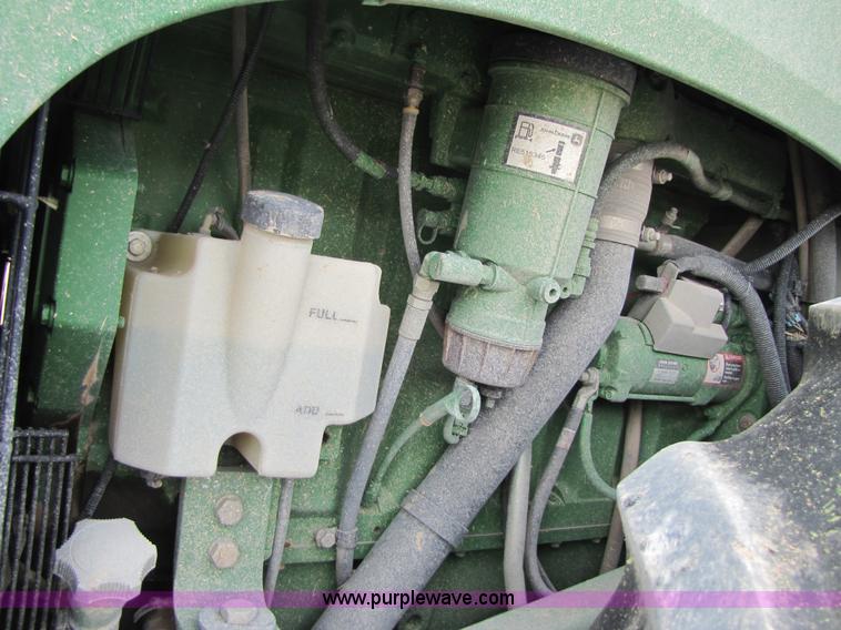 image for item 3145 2005 John Deere 9520 4WD tractor with Grouser two-way blade