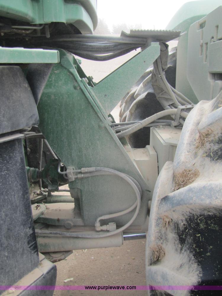 image for item 3145 2005 John Deere 9520 4WD tractor with Grouser two-way blade