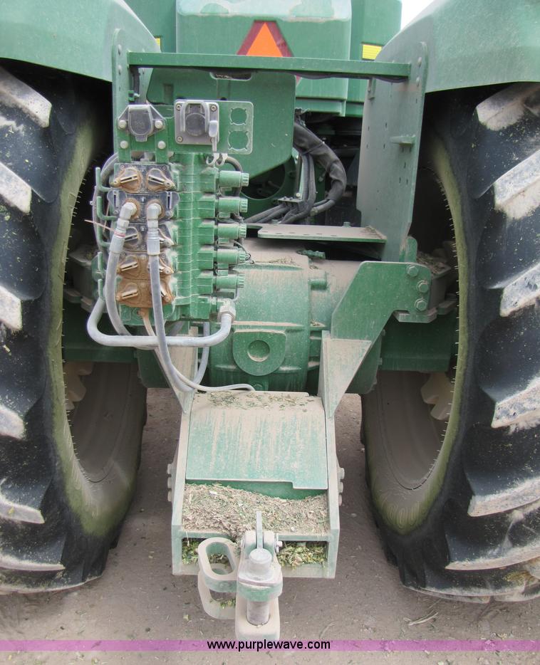 image for item 3145 2005 John Deere 9520 4WD tractor with Grouser two-way blade