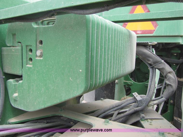 image for item 3145 2005 John Deere 9520 4WD tractor with Grouser two-way blade