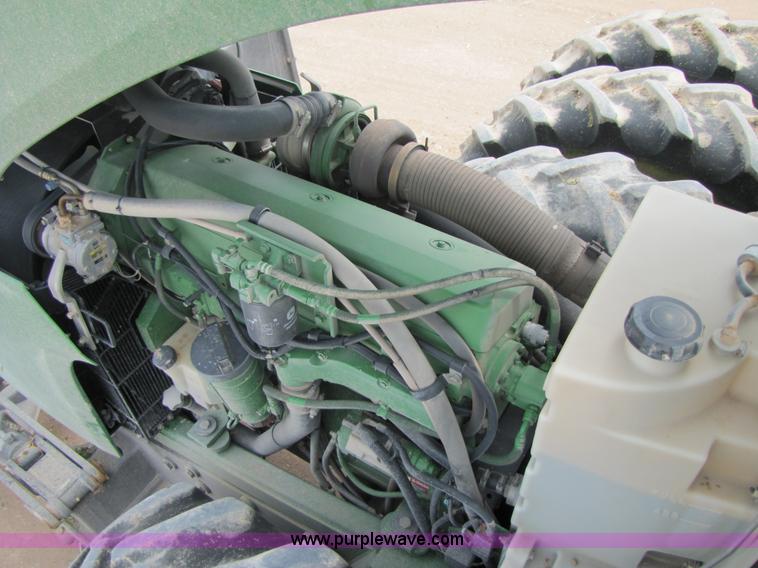 image for item 3145 2005 John Deere 9520 4WD tractor with Grouser two-way blade