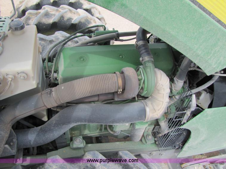 image for item 3145 2005 John Deere 9520 4WD tractor with Grouser two-way blade