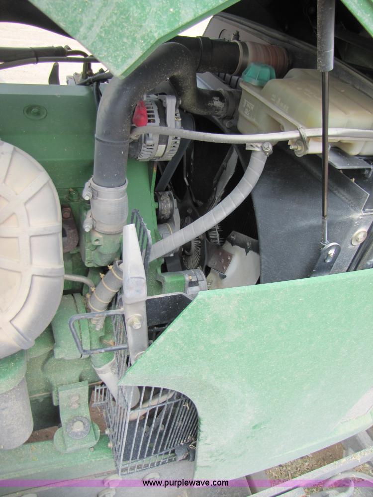 image for item 3145 2005 John Deere 9520 4WD tractor with Grouser two-way blade