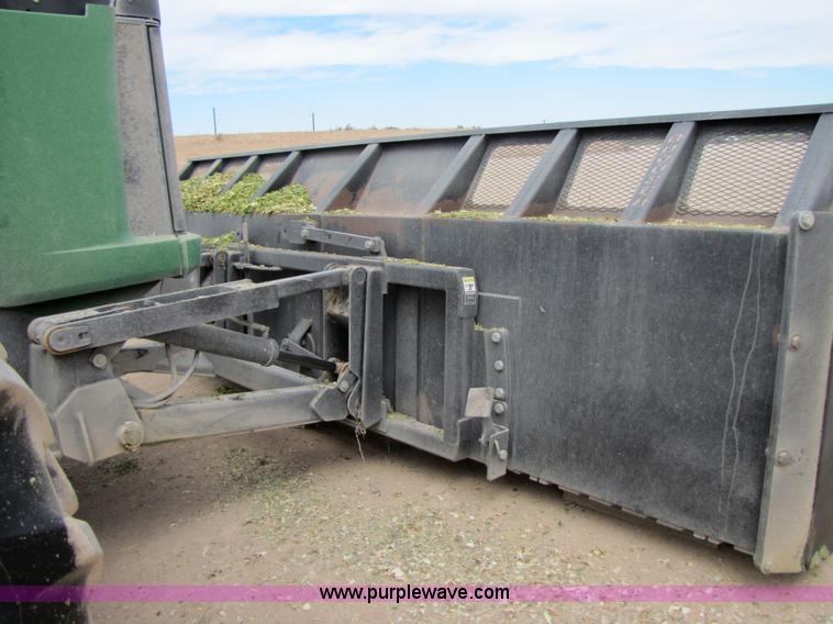 image for item 3145 2005 John Deere 9520 4WD tractor with Grouser two-way blade