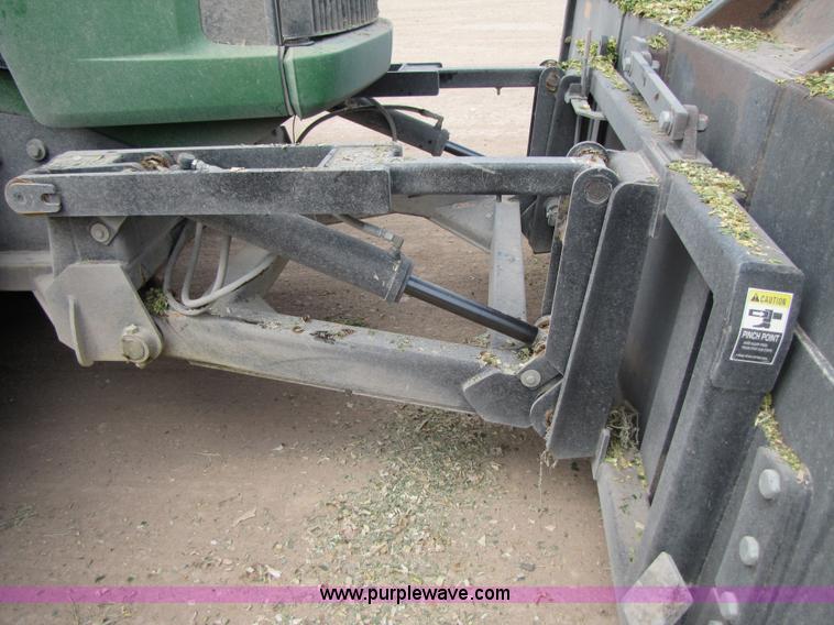 image for item 3145 2005 John Deere 9520 4WD tractor with Grouser two-way blade