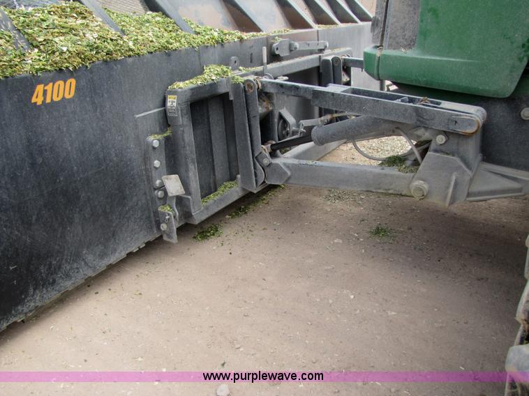 image for item 3145 2005 John Deere 9520 4WD tractor with Grouser two-way blade