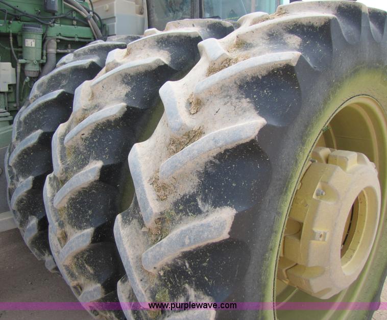 image for item 3145 2005 John Deere 9520 4WD tractor with Grouser two-way blade