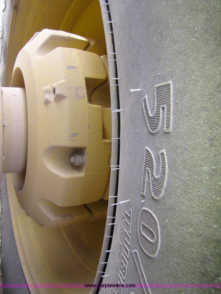 image for item 3145 2005 John Deere 9520 4WD tractor with Grouser two-way blade