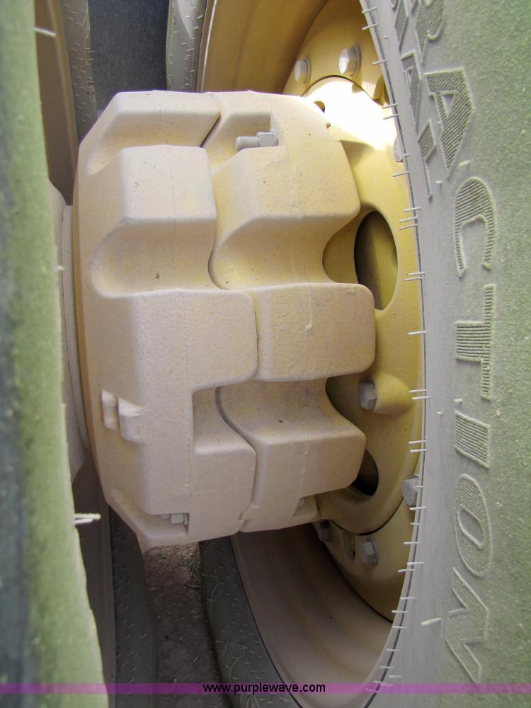 image for item 3145 2005 John Deere 9520 4WD tractor with Grouser two-way blade