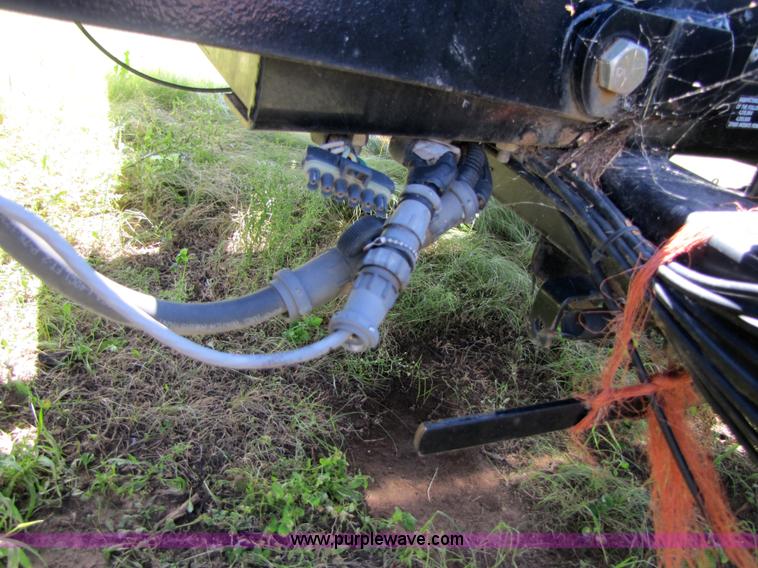 image for item 3147 2004 Challenger BA4 4x4 large square three-bale accumulator