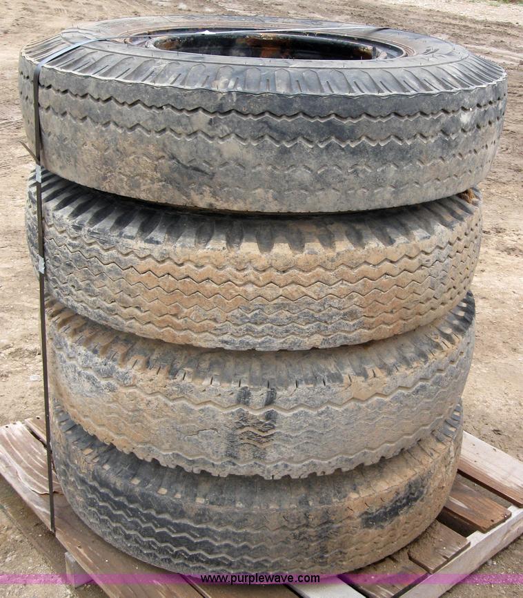 image for item 2552 (8) 9.00-20 rims and tires