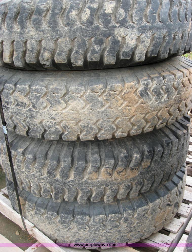 image for item 2553 (8) 9.00-20 rims and tires